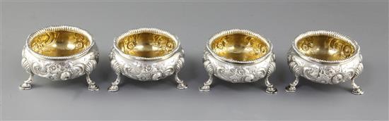 A set of four Victorian embossed silver table salts, by Roberts & Briggs, height 47mm, weight 12.8oz/401grms.